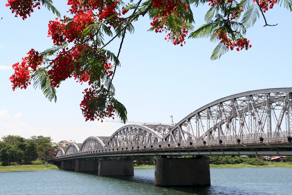 Truong Tien Bridge gracefully spans the Perfume River, a poetic symbol of Hue, where history, romance, and gentle waters meet in perfect harmony